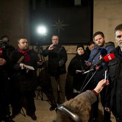 Swedish cartoonist Lars Vilks, right, talks during a press conference, at Politigaarden, after shots were fired where an event titled "Art, blasphemy and the freedom of expression" was being held in Copenhagen, Saturday, Feb. 14, 2015. Shots were fired Saturday at a cafe in Copenhagen that was hosting a freedom of speech event organized by Swedish artist Lars Vilks, who has faced numerous threats for caricaturing the Prophet Muhammad. 