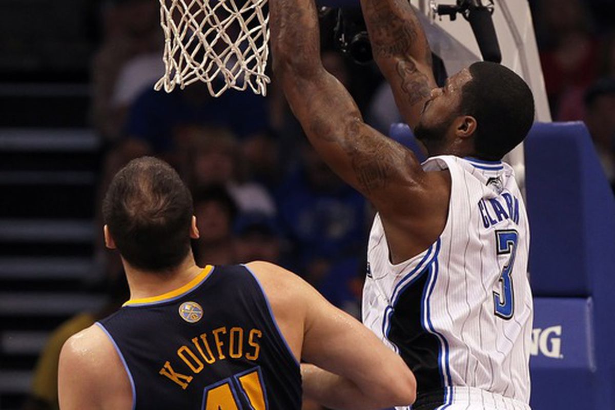 April 1, 2012; Orlando FL, USA; Orlando Magic forward Earl Clark (3) dunks during the first half against the Denver Nuggets at Amway Center. Mandatory Credit: Kim Klement-US PRESSWIRE