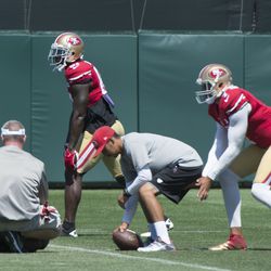 Kap takes a snap from center, with Anquan Boldin out wide