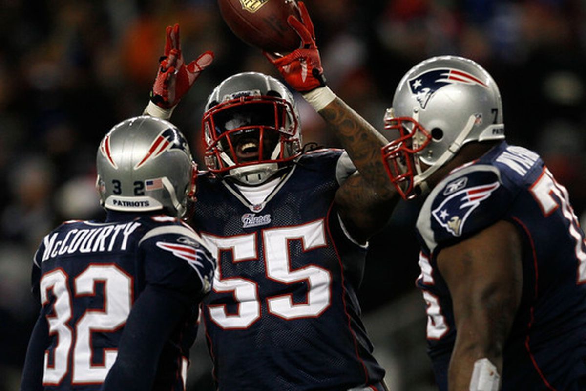 McCourty, Spikes and Wilfork celebrate an interception