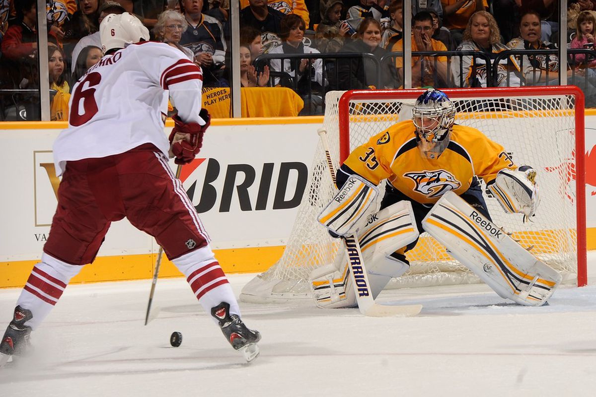 David Schlemko #6 of the Phoenix Coyotes skates towards Pekka Rinne #35 of the Nashville Predators at the Bridgestone Arena on October 13, 2011 in Nashville, Tennessee.  (Photo by Frederick Breedon/Getty Images)