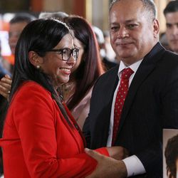 The President of Venezuela's Constituent Assembly, Delcy Rodriguez, left, is congratulated by Assemblyman Diosdado Cabello after the swearing in ceremony inside Venezuela's National Assembly, in Caracas, Venezuela, Friday, Aug. 4, 2017. Venezuelan President Nicolas Maduro is heading toward a showdown with his political foes, after seating a loyalist assembly that will rewrite the country's constitution and hold powers that override all other government branches. 