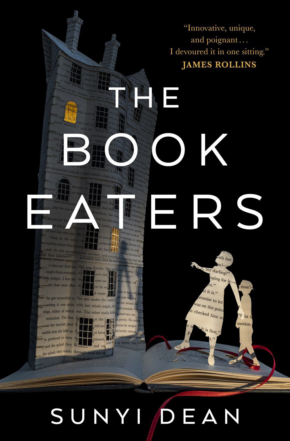Cover image of The Book Eaters by Sunyi Dean, featuring a diorama of a parent, child, and home, all made up of pages from a book, while standing on a book.