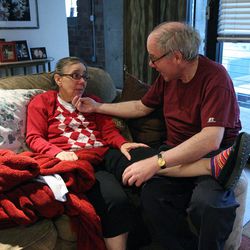 Martin Personick helps his wife, Valerie, who has Alzheimer's, at their apartment in Salt Lake City, Thursday, Oct. 18, 2012. Martin receives help from Homewatch CareGivers in caring for Valerie.