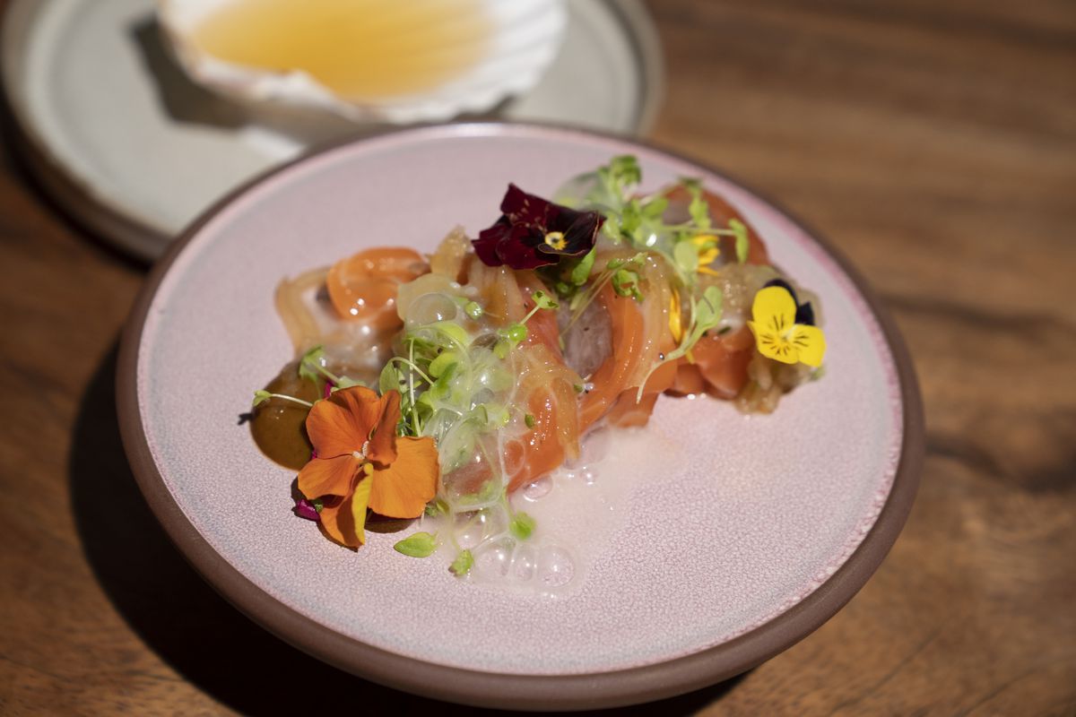 Wild’s Tiradito with raw blue fin tuna topped with edible flowers, microgreens, and bubbles.