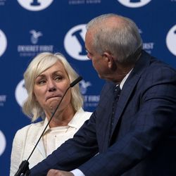 BYU head men's basketball coach Dave Rose looks over at his wife Cheryl as he announces his retirement at a news conference inside the Marriott Center at Brigham Young University on Tuesday, March 26, 2019.