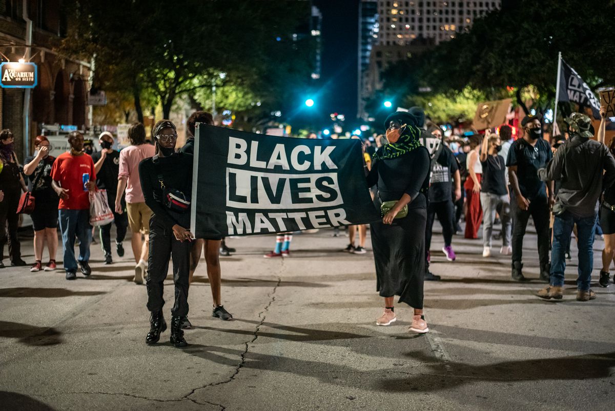 People marching in downtown Austin after a vigil for&nbsp;Garrett Foster in July. He was shot and killed during a Black Lives Matter protest that month.