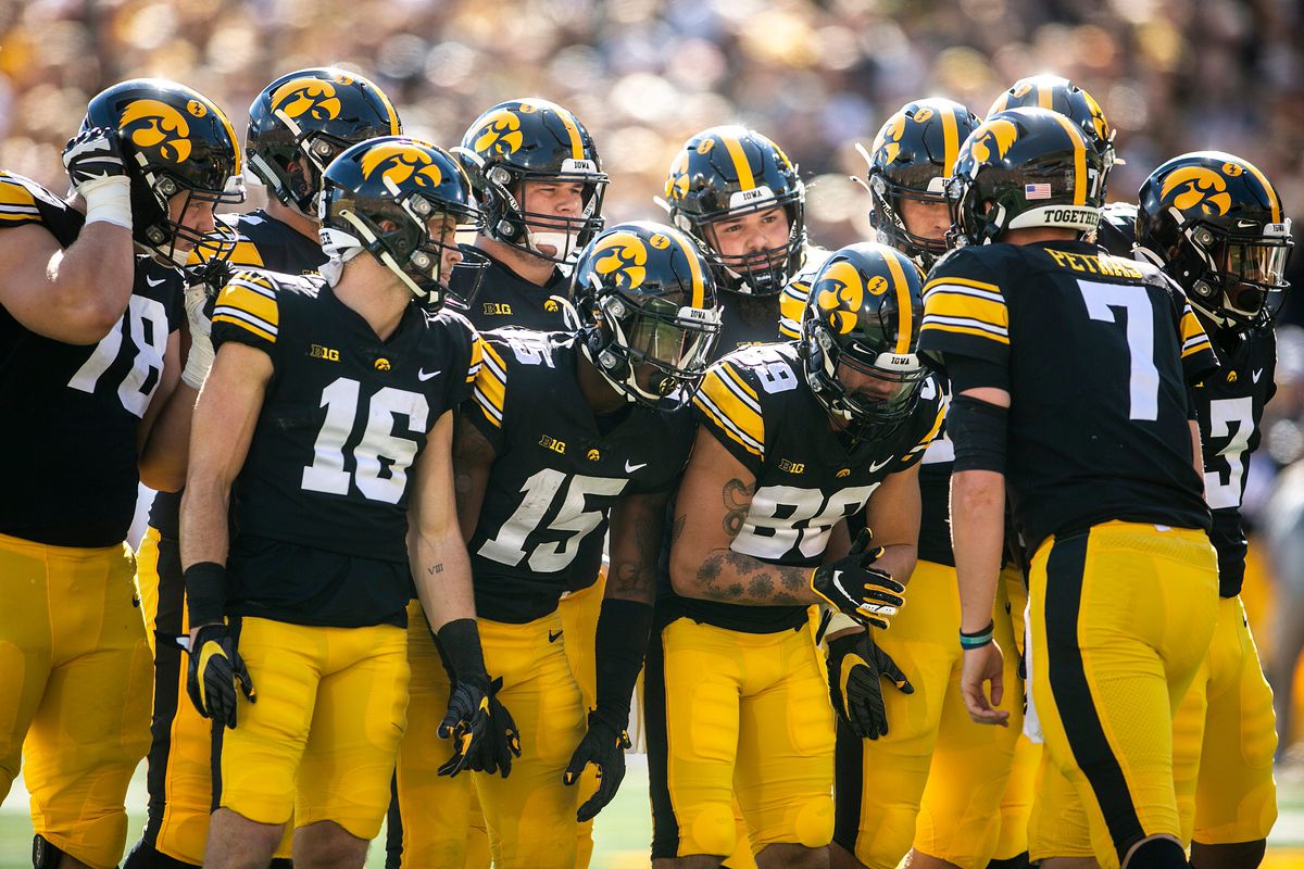 Iowa quarterback Spencer Petras huddles up with teammates before a play during a NCAA non-conference football game against Colorado State, Saturday, Sept. 25, 2021, at Kinnick Stadium in Iowa City, Iowa.&nbsp;