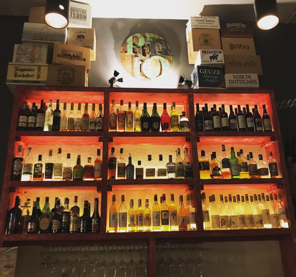 Rows of bottles on a backlit bar
