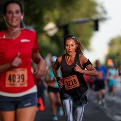 Maryam Salehi approaches the finish line of the Deseret News 10K at Liberty Park in Salt Lake City on Tuesday, July 24, 2018.