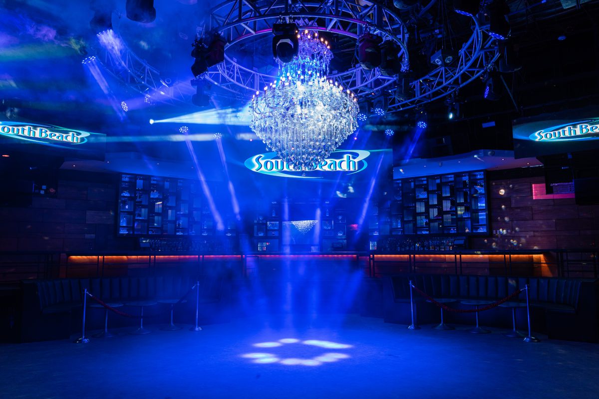 South Beach’s dance floor, illuminated by strobe lights and its 450-pound crystal chandelier.
