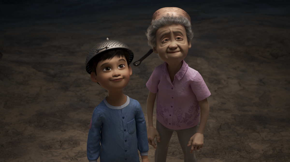 a boy and his grandma both wearing pots on their heads