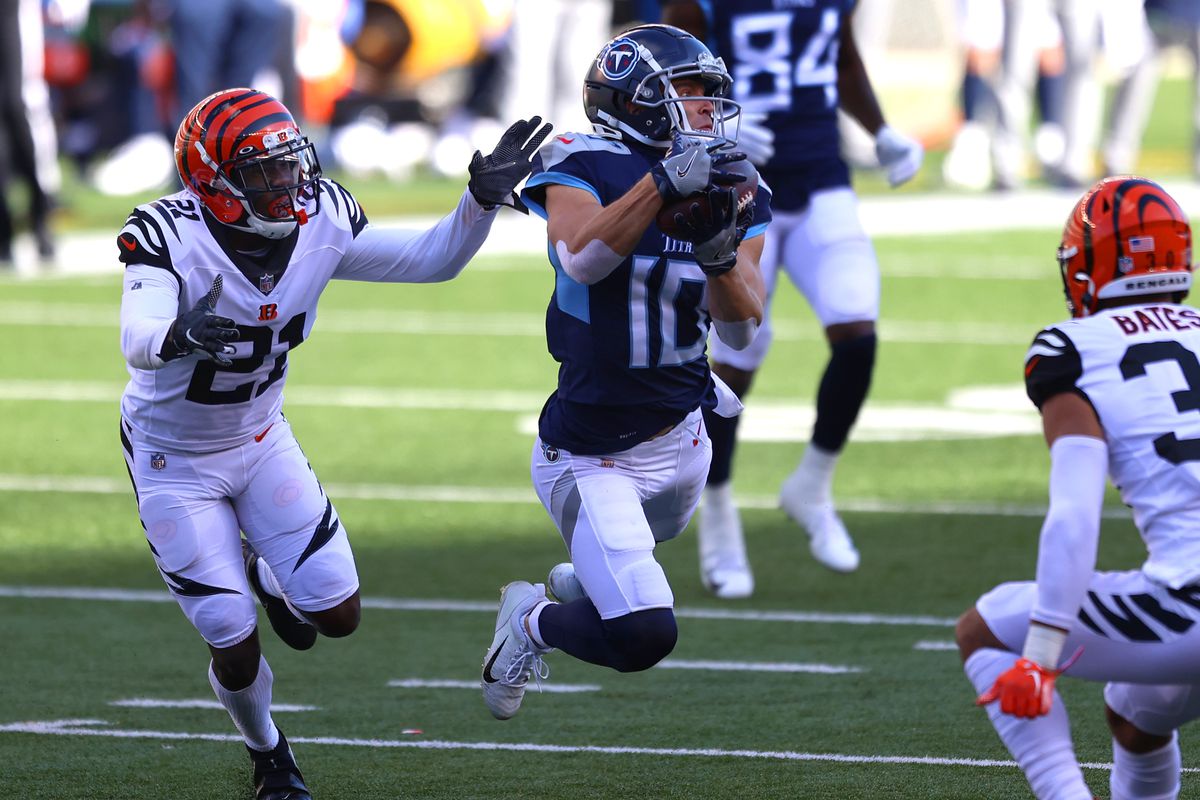 Mackensie Alexander #21 and Jessie Bates III #30 of the Cincinnati Bengals defend against Adam Humphries #10 of the Tennessee Titans on a pass play in the second quarter of the game at Paul Brown Stadium on November 01, 2020 in Cincinnati, Ohio.