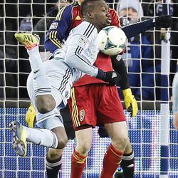 Kansas City's C.J. Sapong tries to kick the ball into the goal as Real's Nat Borchers gets in his way as Real Salt Lake and Sporting KC play Saturday, Dec. 7, 2013 in MLS Cup action. Sporting KC won in a shootout.