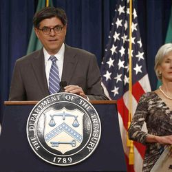 Treasury Secretary Jacob Lew, accompanied by Health and Human Services Secretary Kathleen Sebelius, speaks about Social Security and Medicare, Friday, May 31, 2013, at the Treasury Department in Washington. The government says Medicare's giant hospital trust will not be exhausted until 2026, while the date that Social Security will exhaust its trust fund is unchanged at 2033.  The date for Medicare is two years later than was projected last year.  (AP Photo/Charles Dharapak)
