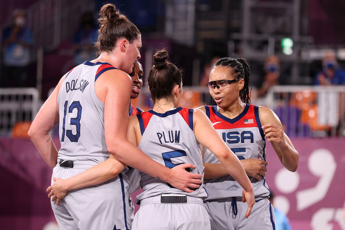 Allisha Gray, Kelsey Plum, Stefanie Dolson and Jacquelyn Young of Team United States celebrate victory in the 3x3 Basketball competition on day three of the Tokyo 2020 Olympic Games at Aomi Urban Sports Park on July 26, 2021 in Tokyo, Japan.