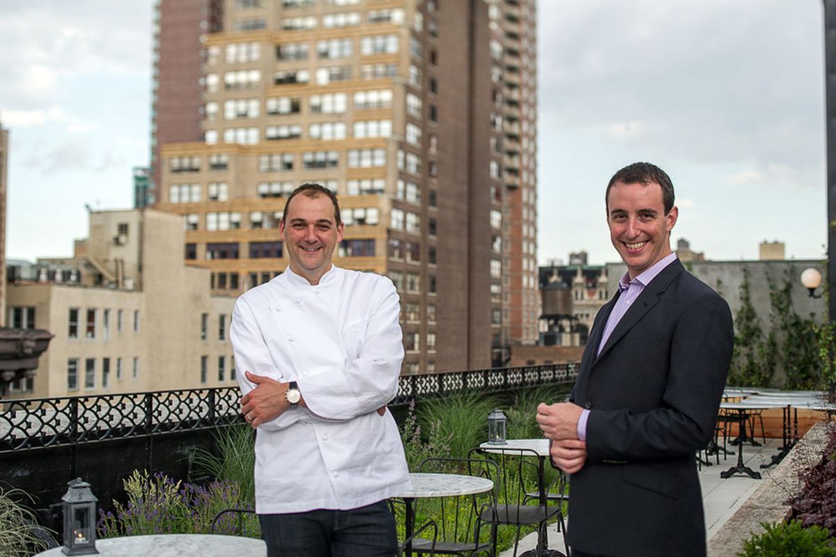 Daniel Humm and Will Guidara on the Nomad rooftop smiling