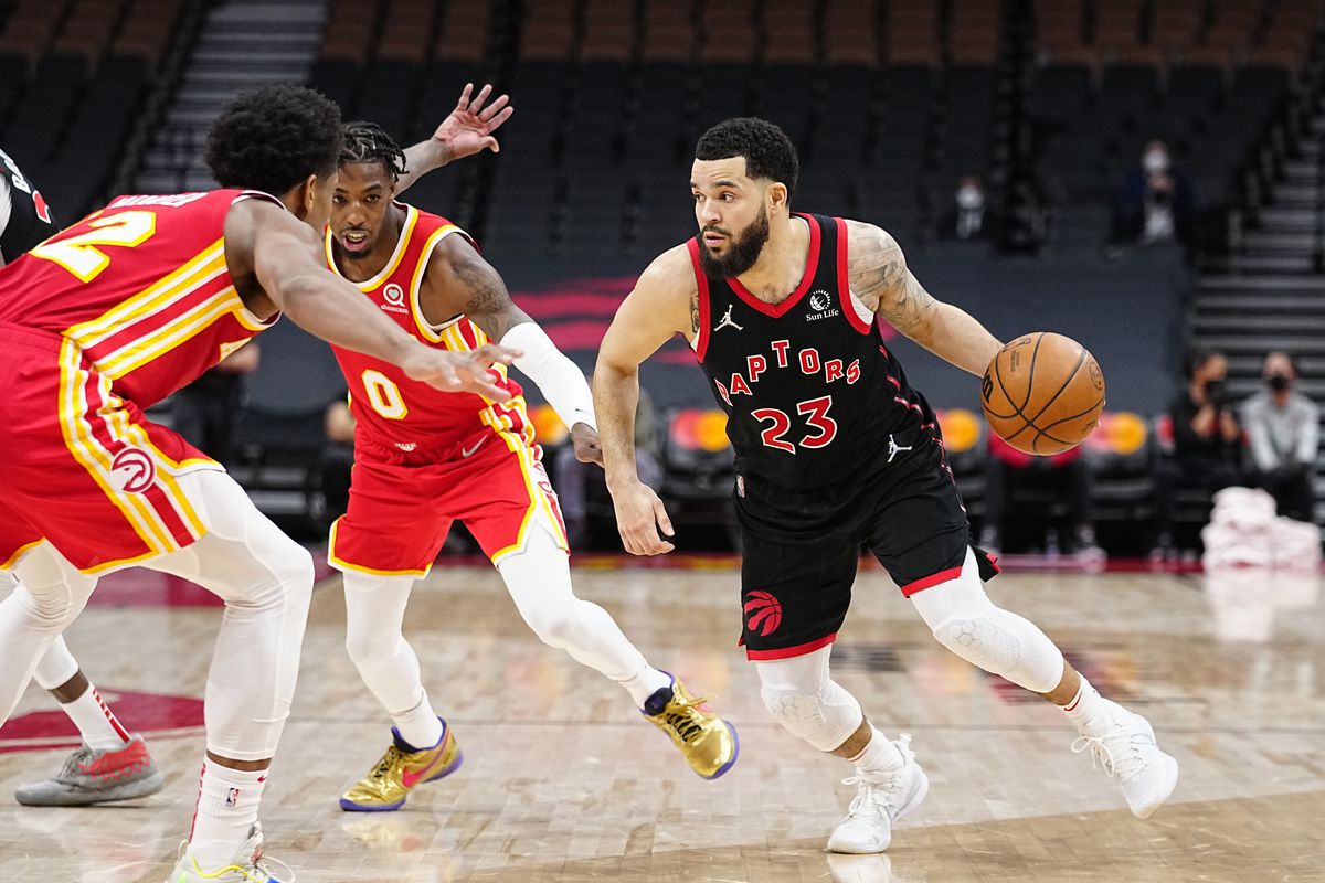 Toronto Raptors guard Fred VanVleet (23) drives to the net against Atlanta Hawks forward De’Andre Hunter (12) and guard Delon Wright (0) during the second half at Scotiabank Arena.