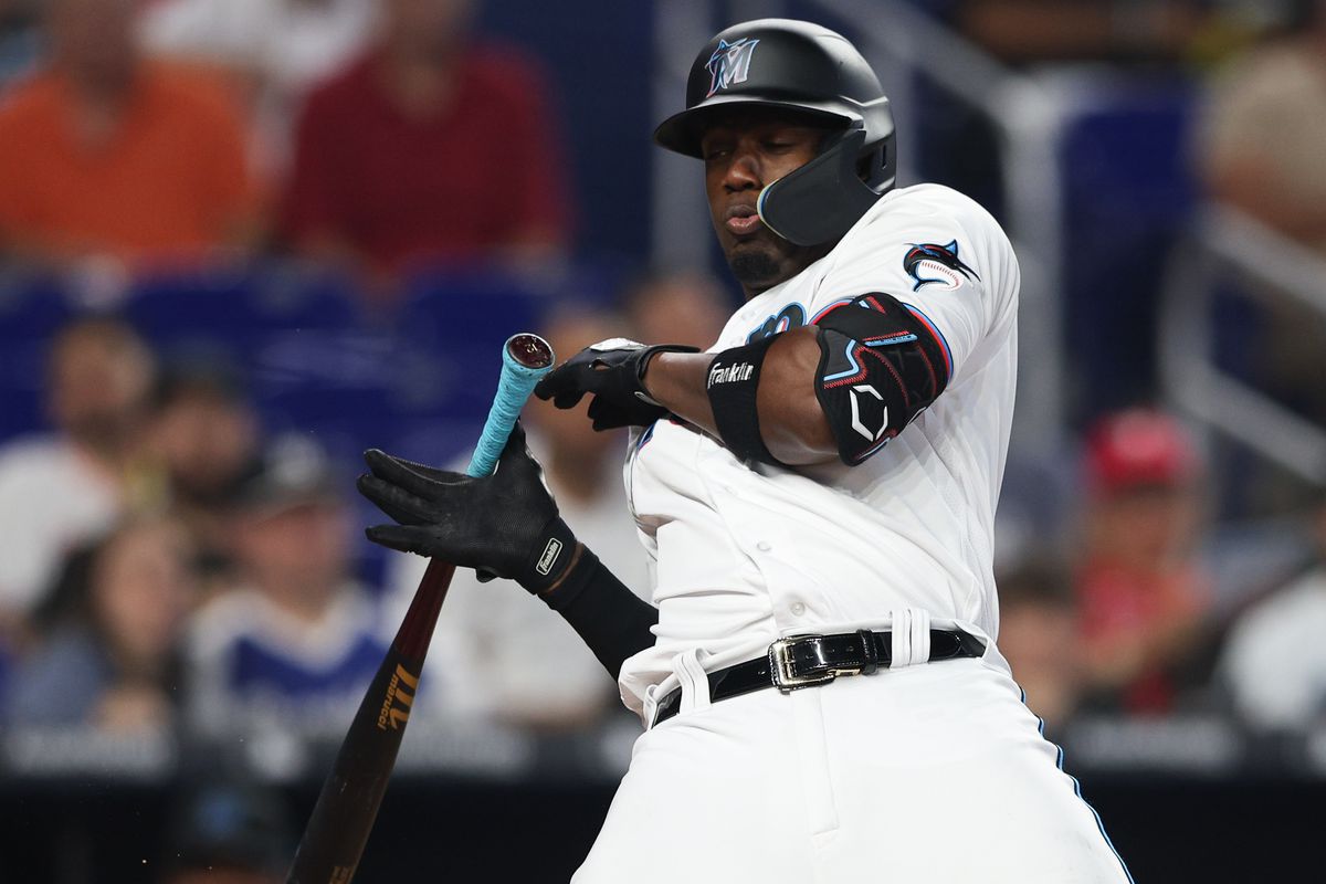 Miami Marlins right fielder Jorge Soler (12) is hit by a pitch during a game against the Philadelphia Phillies in the fourth inning at loanDepot Park.