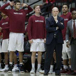 Santa Clara head coach Herb Sendek, third from right, and his bench watch during the second half of the team's NCAA college basketball game against BYU in Santa Clara, Calif., Saturday, Jan. 13, 2018. (AP Photo/Jeff Chiu)