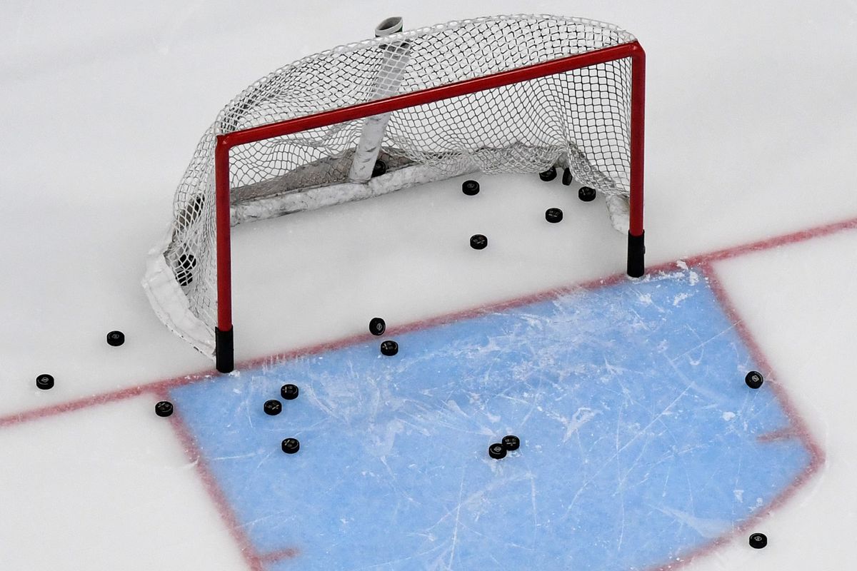 Pucks are shown in and around a net during warmups before a game between the Los Angeles Kings and the Vegas Golden Knights at T-Mobile Arena on March 1, 2020 in Las Vegas, Nevada.