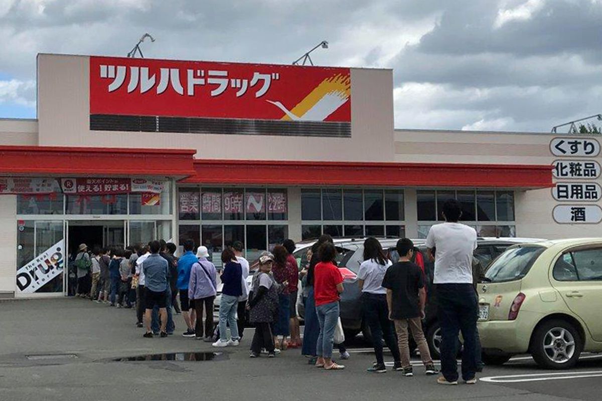 People line up outside a supermarket due to rush to buy supplies after an earthquake, in Biei town, Hokkaido, northern Japan.