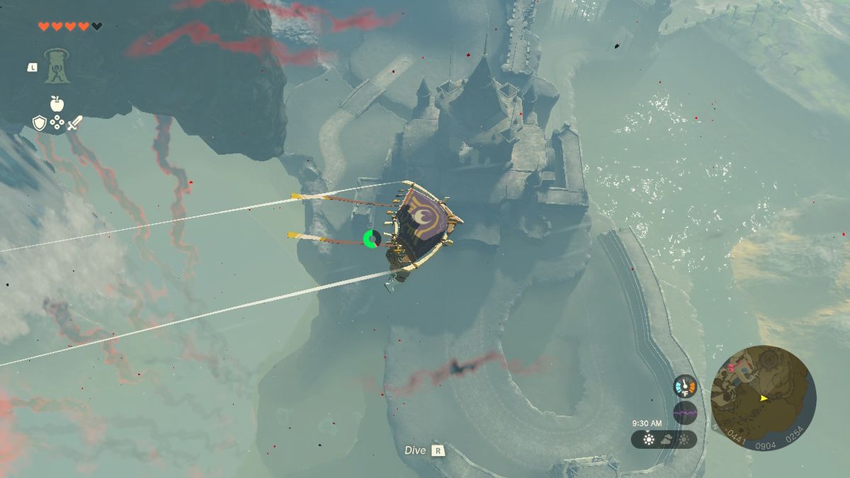 Link glides high above Hyrule Castle in Zelda Tears of the Kingdom.