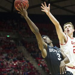 Utah forward Tyler Rawson (21) contests a shot by Butler guard Kamar Baldwin (3) during an NCAA college basketball game at the Huntsman Center in Salt Lake City on Monday, Nov. 28, 2016. Butler took down Utah 68-59 to remain undefeated.