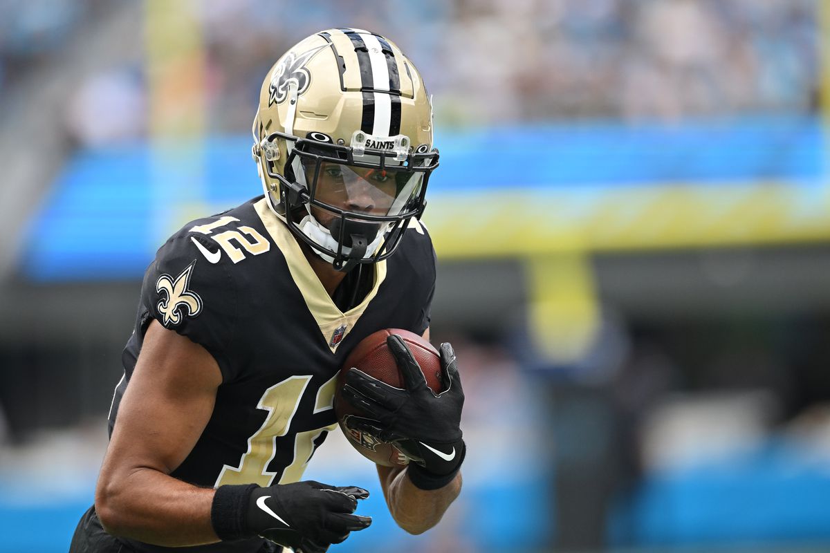 CHARLOTTE, NORTH CAROLINA - SEPTEMBER 25: Chris Olave #12 of the New Orleans Saints makes a catch against the Carolina Panthers during their game at Bank of America Stadium on September 25, 2022 in Charlotte, North Carolina.