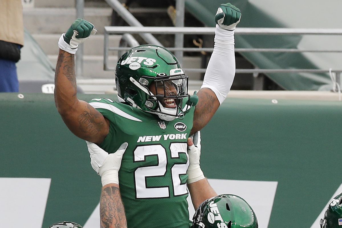 La’Mical Perine #22 of the New York Jets celebrates his touchdown against the Buffalo Bills with teammate Connor McGovern #60 at MetLife Stadium on October 25, 2020 in East Rutherford, New Jersey. The Bills defeated the Jets 18-10.