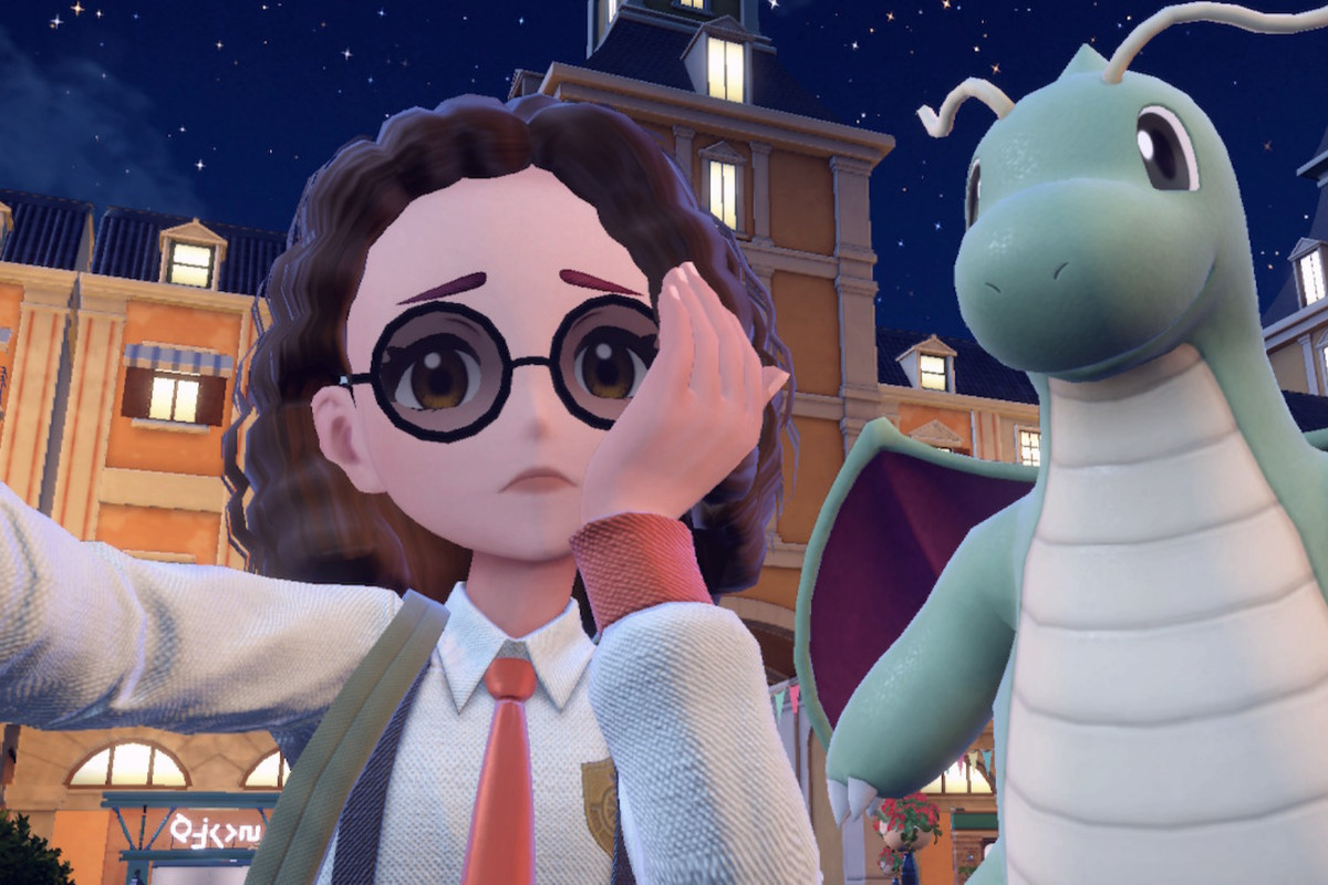 an image of a pokemon trainer in pokemon scarlet taking a selfie with a shiny dragonite. she looks worried in the photo.