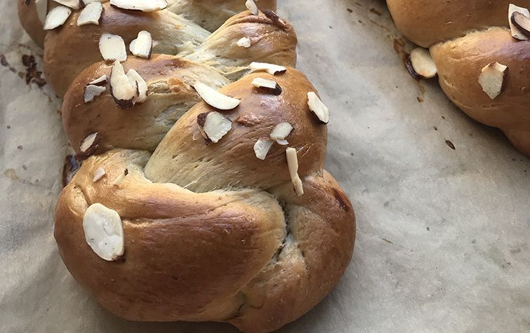 A braided Finnish loaf sprinkled with almonds.