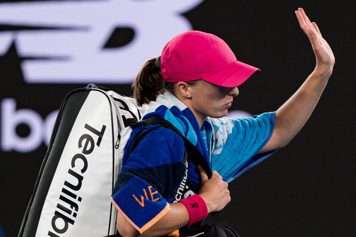 Iga Swiatek of Poland acknowledges the crowd while leaving the arena after losing their round three singles match against Linda Noskova of the Czech Republic during day seven of the 2024 Australian Open at Melbourne Park on January 20, 2024 in Melbourne, Australia.