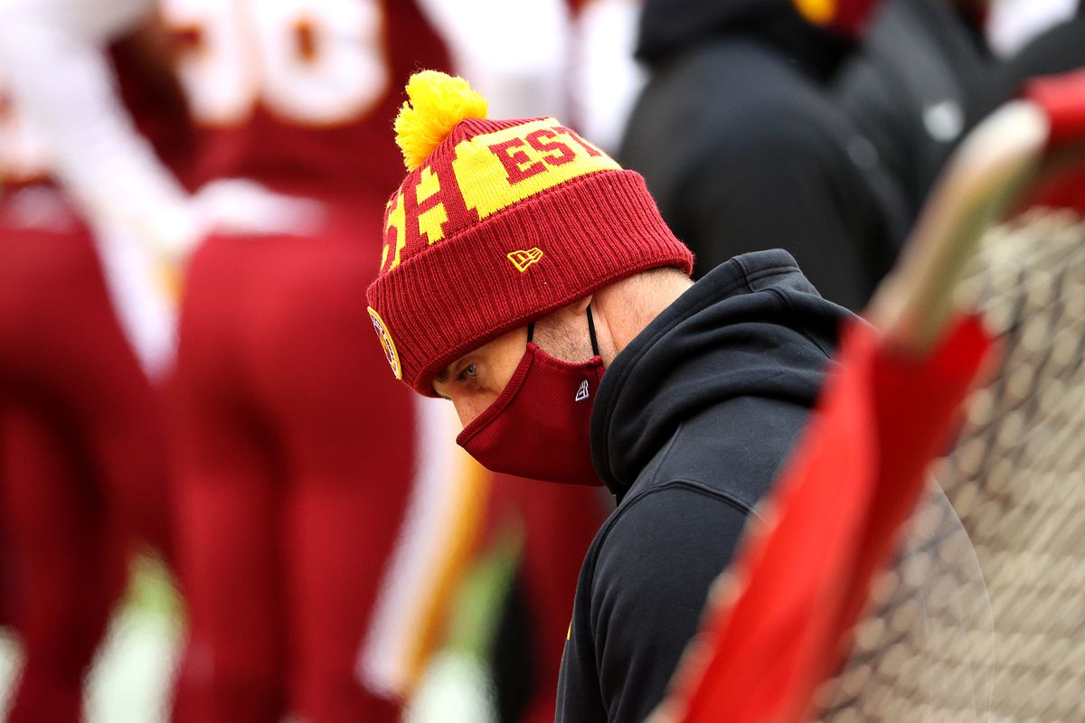 Quarterback Alex Smith #11 of the Washington Football Team looks on from the sidelines in the first half against the Seattle Seahawks at FedExField on December 20, 2020 in Landover, Maryland.