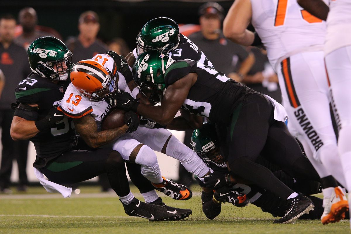 Cleveland Browns wide receiver Odell Beckham Jr. is tackled by New York Jets linebacker Blake Cashman and safety Jamal Adams and defensive end Tarell Basham during the first quarter at MetLife Stadium.