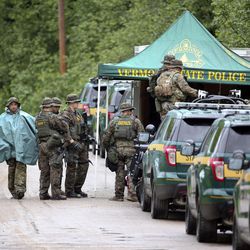 Law enforcement officers gather as the search continues for two prison escapees from Clinton Correctional Facility in Dannemora, on Tuesday, June 23, 2015, in Malone, N.Y.  Police began focusing intensely on the area 20 miles west of the prison that inmates David Sweat and Richard Matt escaped on June 6. 