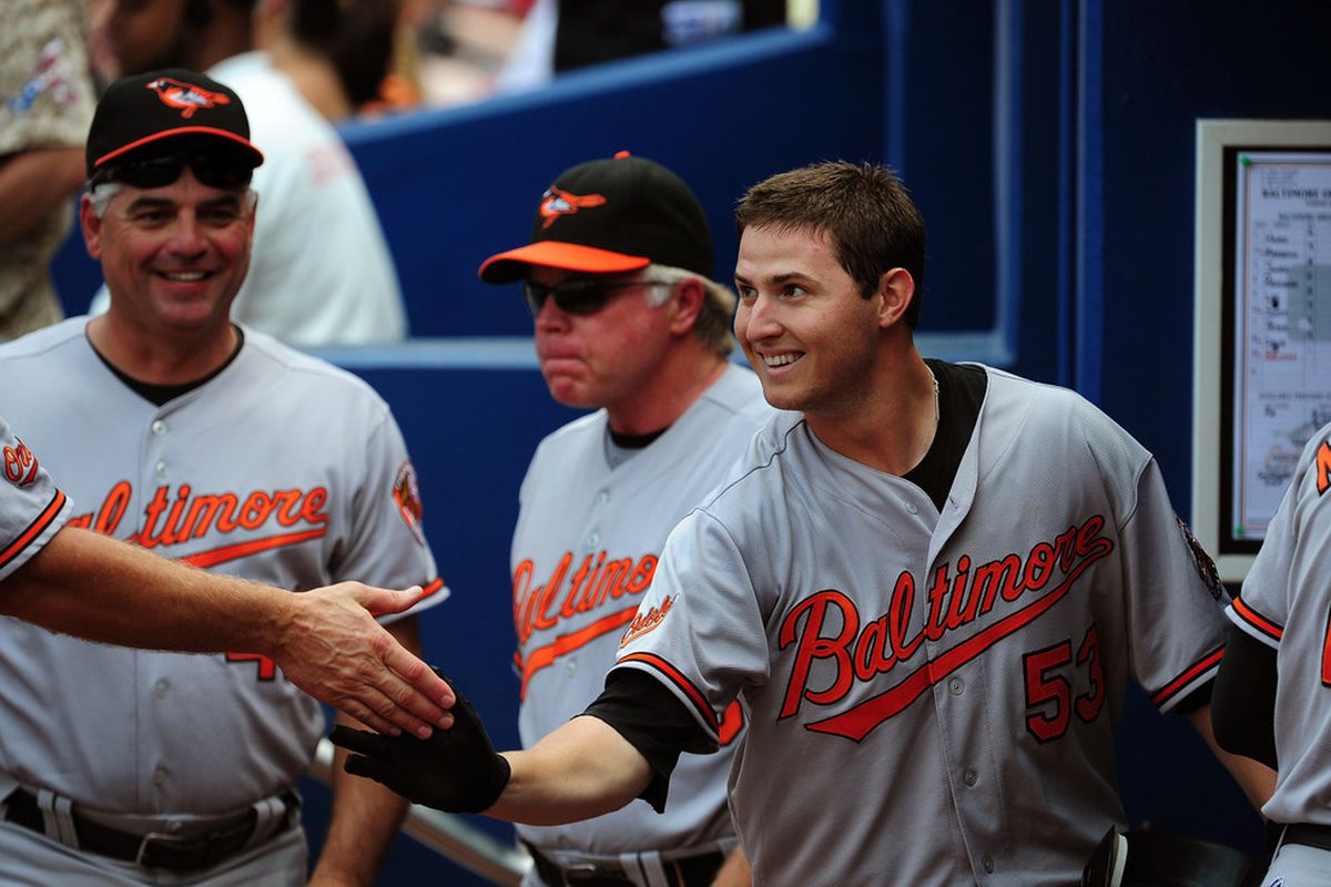 ATLANTA - JULY 3: Zach Britton #53 of the Baltimore Orioles is congratulated by teammates after hitting a 3rd inning home run against the Atlanta Braves at Turner Field on July 3, 2011 in Atlanta, Georgia. (Photo by Scott Cunningham/Getty Images)