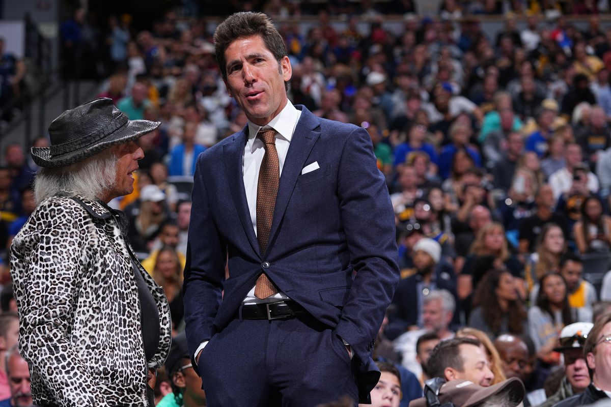 NBA Superfan, James Goldstein talks to General Manager, Bob Myers of the Golden State Warriors during Round 1 Game 4 of the 2022 NBA Playoffs on April 24, 2022 at the Ball Arena in Denver, Colorado.&nbsp;