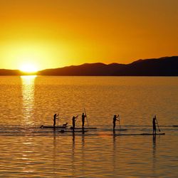 Paddleboarders at sunset on the Great Salt Lake on Monday, Sept. 6, 2010.
