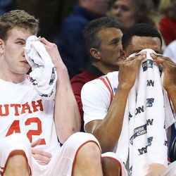  Utah Utes forward Jakob Poeltl (42) and Utah Utes forward Dakarai Tucker (14) watch the final seconds of the game during the NCAA basketball tournament second round in Denver,  Saturday, March 19, 2016. Gonzaga won 82-59. 