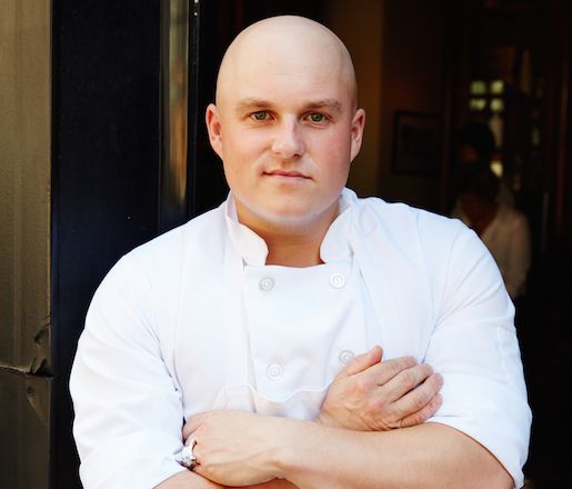 A portrait of chef Ryan Bartlow in chef whites