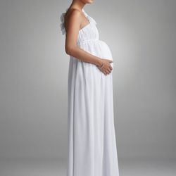 Month 9: The countdown begins! With a foot wedged under your rib cage, you'll take comfort where you can get it. This <a href="http://www.davidsbridal.com/Product_Floral-One-Shoulder-Chiffon-Maternity-Dress-261208D_Bridal-Gowns-Shop-By-Size-Maternity-Gown