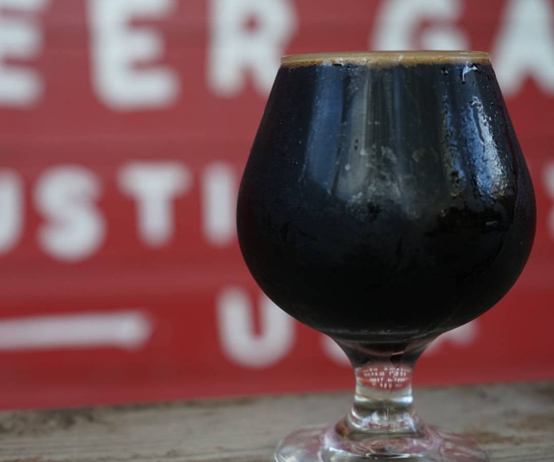 A glass of dark beer.