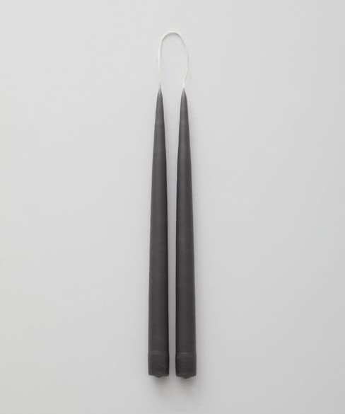 Two tapered gray candles.