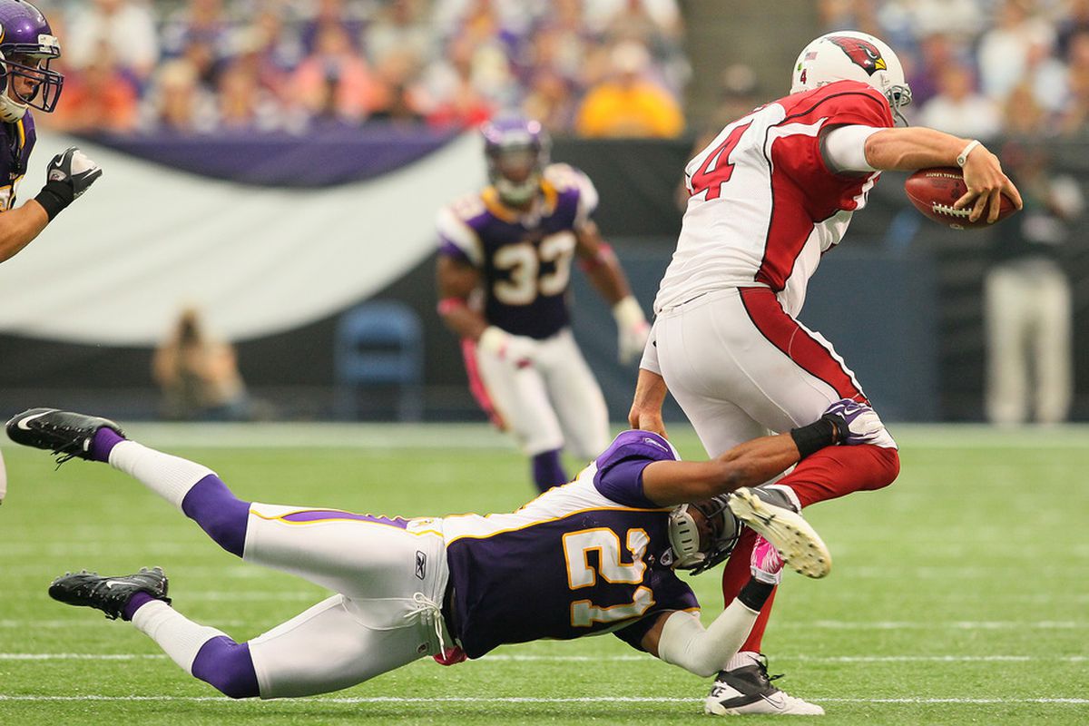 MINNEAPOLIS, MN - OCTOBER 09:  Asher Allen #21 of the Minnesota Vikings sacks  Kevin Kolb #4 of the Arizona Cardinals at the Hubert H. Humphrey Metrodome on October 9, 2011 in Minneapolis, Minnesota.  (Photo by Adam Bettcher /Getty Images)