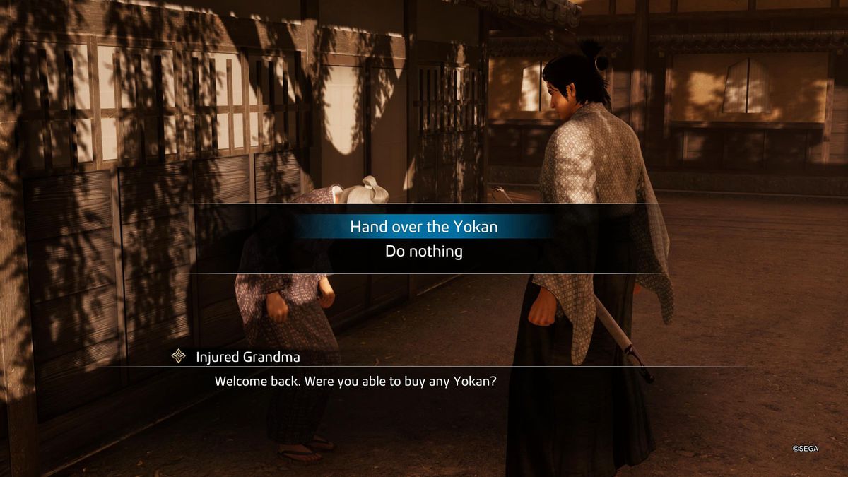 Ryoma hands medicine to an injured grandma in Like a Dragon: Ishin!