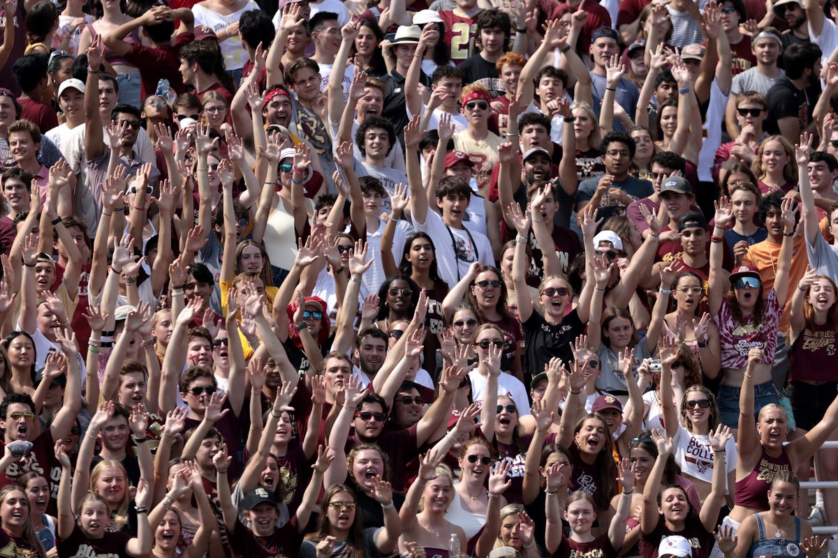 Boston College fans raise their hands in the air in the second quarter.