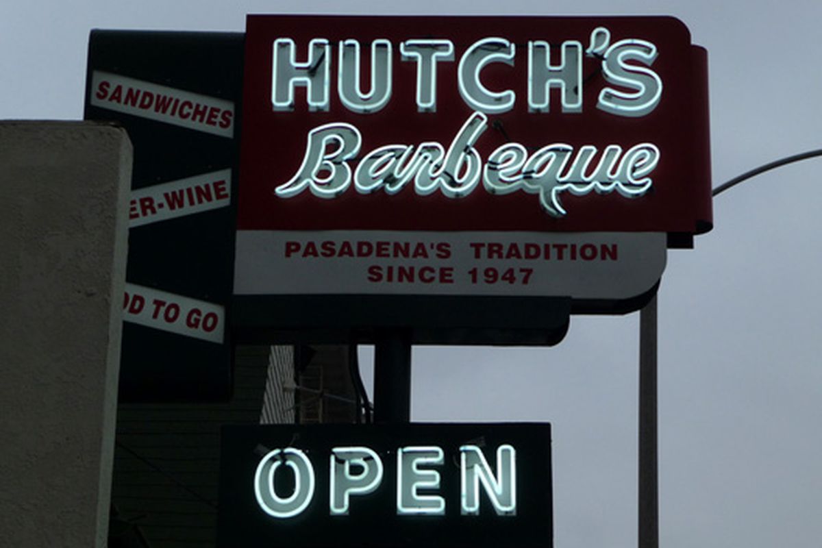 Gray skies, bright neons at Hutch's Barbeque. 
