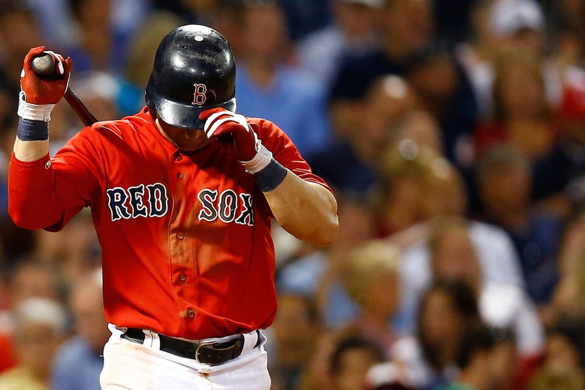 BOSTON, MA - JULY 06: Nick Punto #5 of the Boston Red Sox reacts after striking out against the New York Yankees on July 6, 2012 at Fenway Park in Boston, Massachusetts.  (Photo by Jared Wickerham/Getty Images)