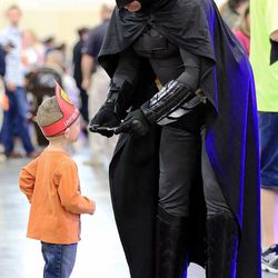 Beckett Graul talks with Batman at the Safe Kid Fair Friday, Feb. 20, 2015, at the South Towne Expo in Sandy.